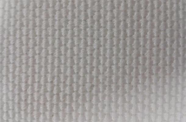 Woven cloth of polyester, 3200 g/m<sup>2</sup>, thickness 5 mm, breathability 63 m<sup>3</sup>/m<sup>2</sup>/h under 100 mm of water column.